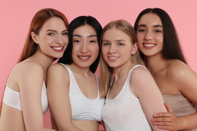 Photo of Portrait of beautiful young women on pink background