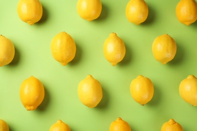 Photo of Flat lay composition with fresh ripe lemons on color background