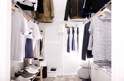 Photo of Modern dressing room with different stylish clothes and accessories