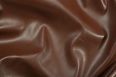Photo of Brown natural leather as background, top view