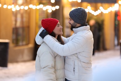 Photo of Lovely couple spending time together on city street