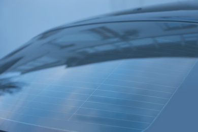 Photo of Modern car with tinting foil on window, closeup