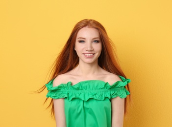 Photo of Portrait of young model with beautiful  hair on color background