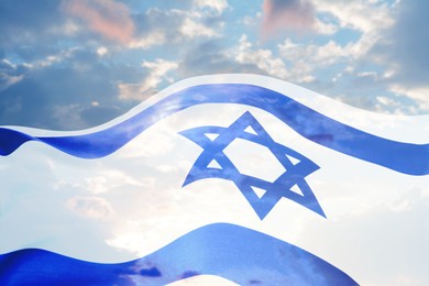 Image of National flag of Israel and blue sky with clouds, double exposure