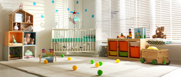 Image of Baby room interior with comfortable crib. Banner design