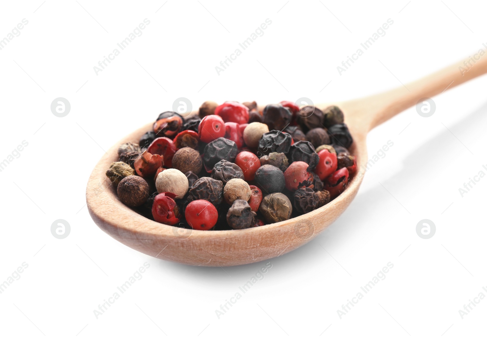 Photo of Wooden spoon with different pepper grains on white background