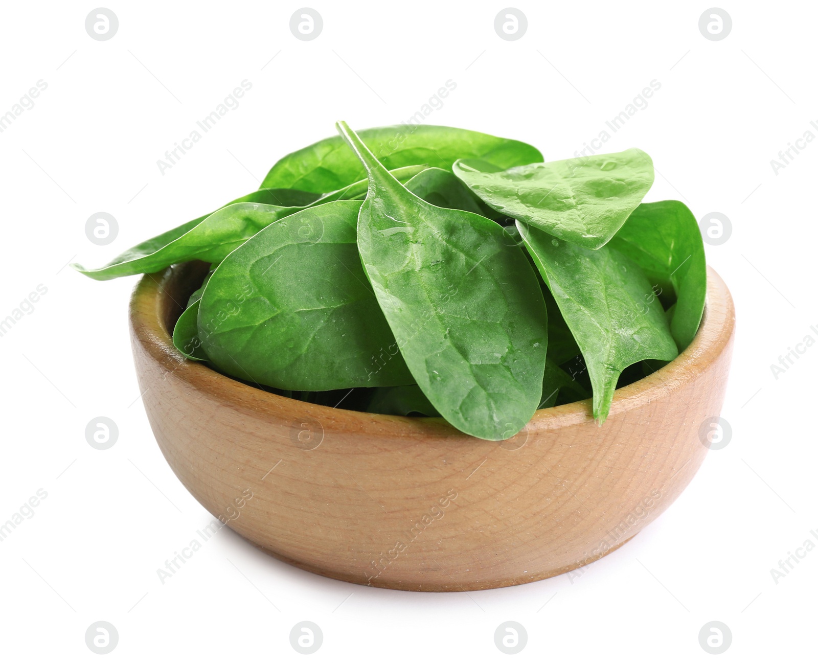 Photo of Fresh green healthy baby spinach leaves in wooden bowl isolated on white