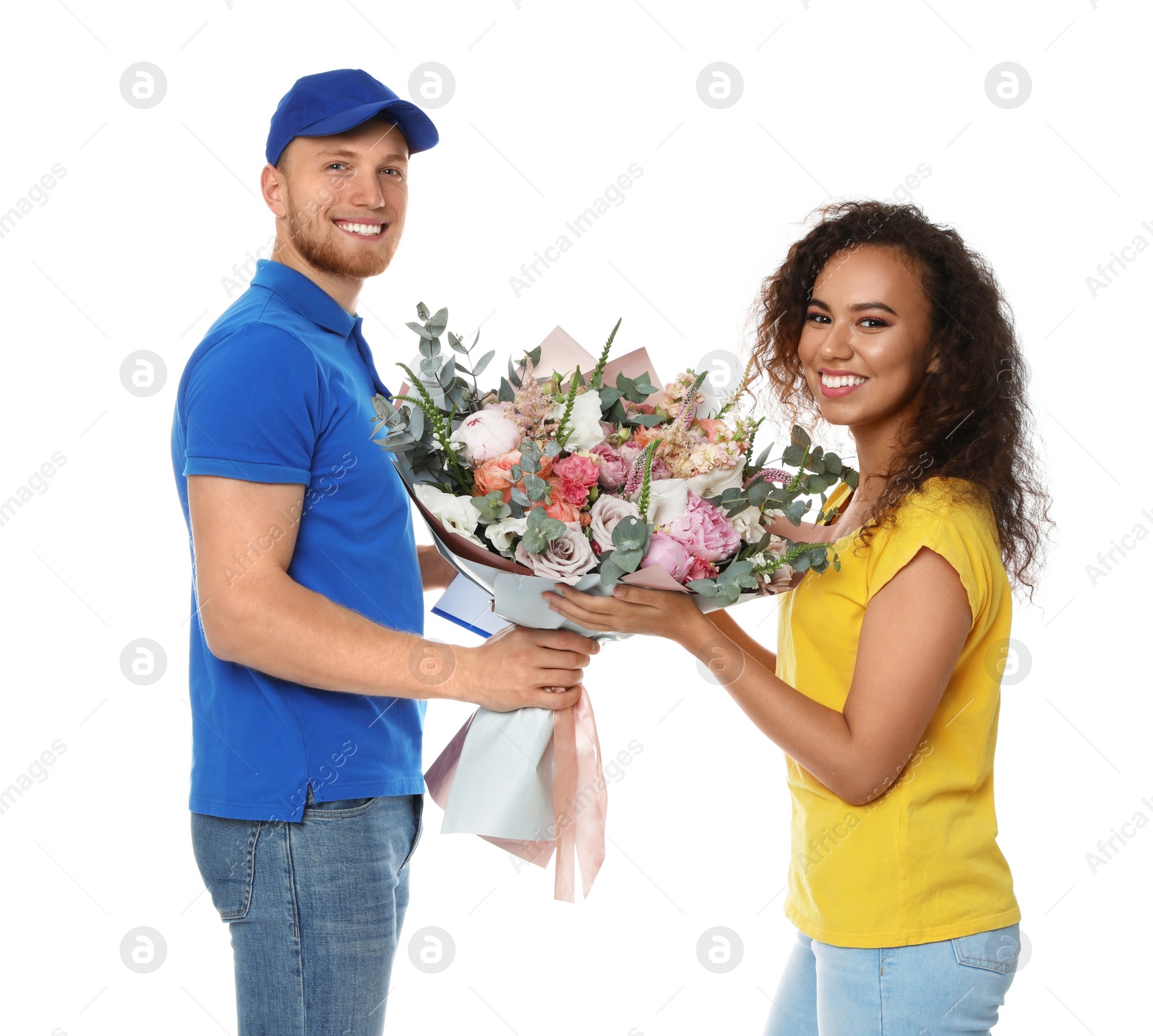 Photo of African-American woman receiving flower bouquet from delivery man isolated on white