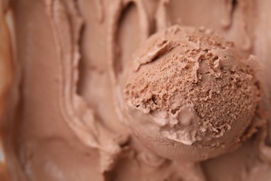 Tasty chocolate ice cream as background, closeup. Space for text