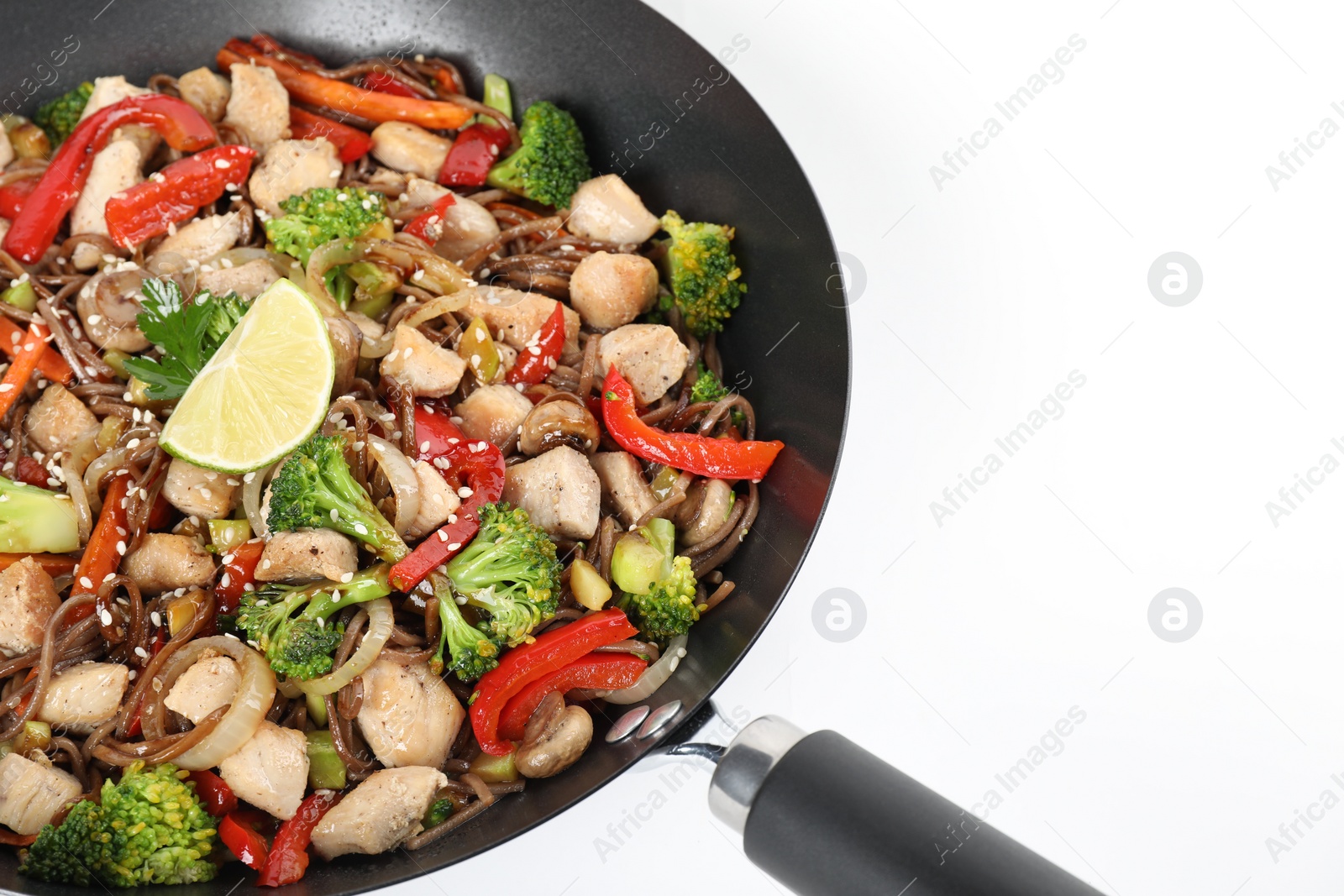 Photo of Stir-fry. Tasty noodles with meat and vegetables in wok on white background