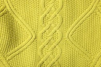 Photo of Texture of soft yellow fabric as background, top view
