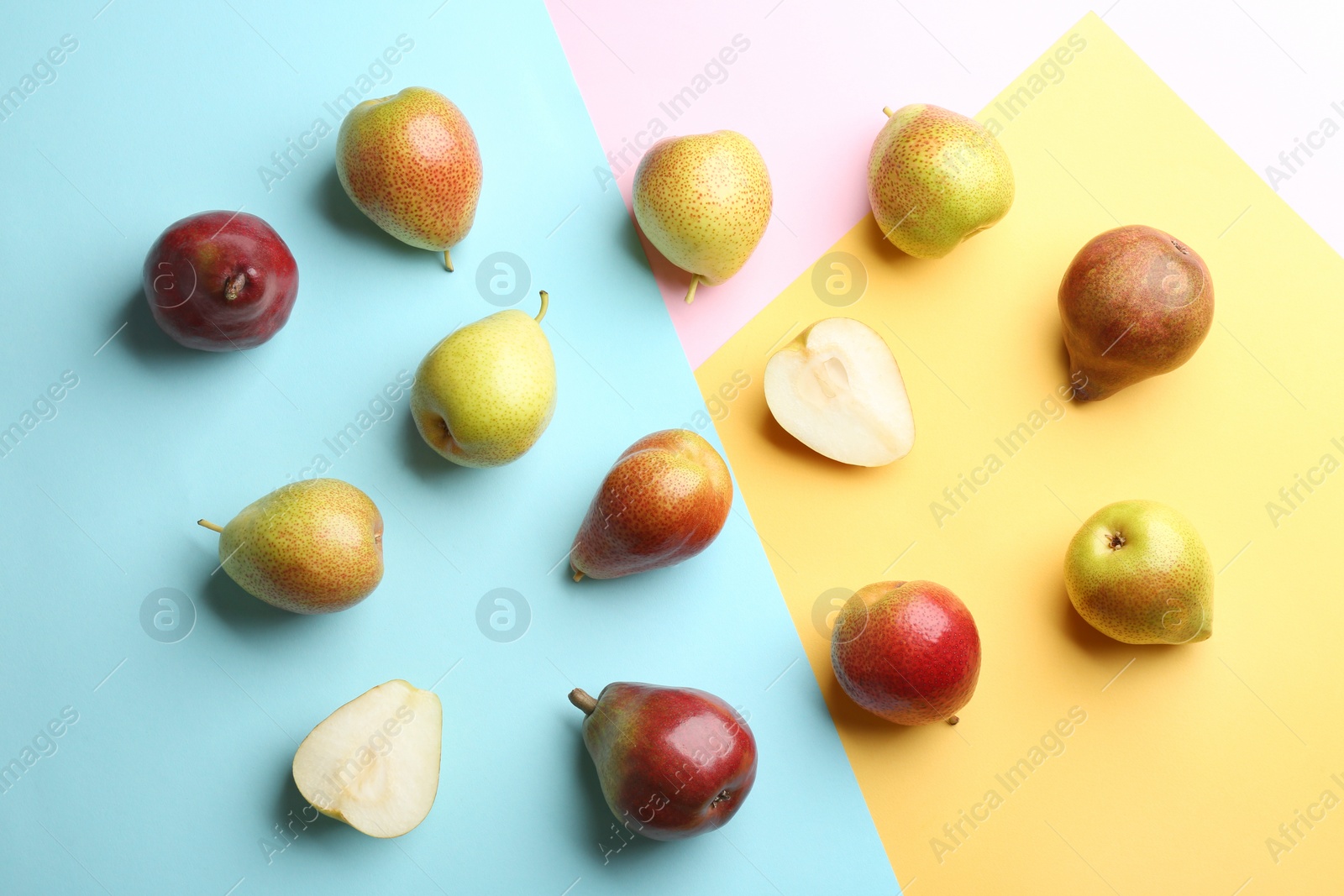 Photo of Ripe juicy pears on color background, flat lay