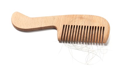 Photo of Wooden comb with lost hair isolated on white, above view