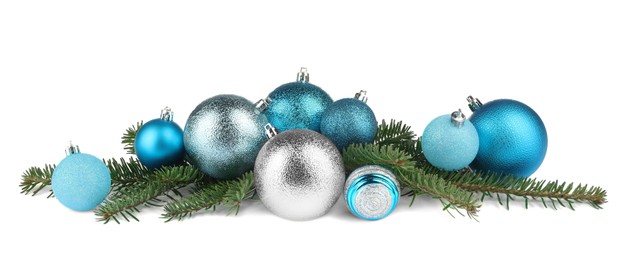 Photo of Beautiful Christmas balls and fir tree branches isolated on white