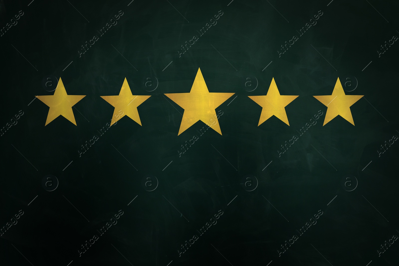 Image of Quality evaluation. Golden stars on green chalkboard