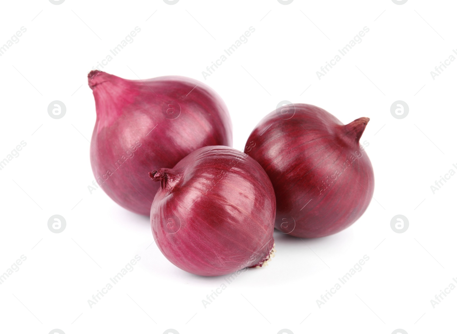 Photo of Fresh whole red onions on white background