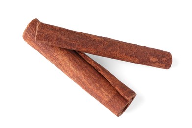 Photo of Cinnamon sticks isolated on white, top view