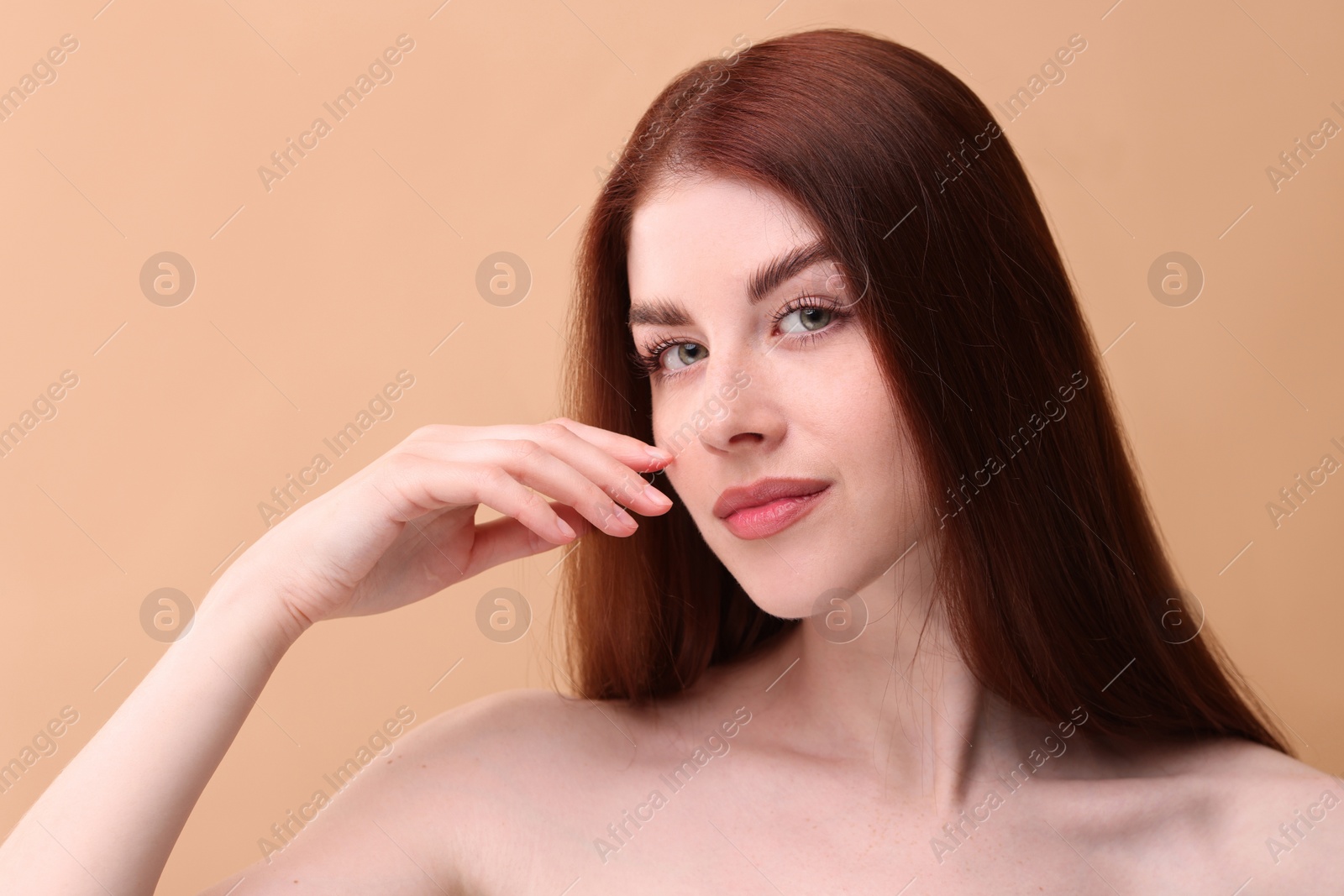 Photo of Portrait of beautiful woman on beige background, closeup