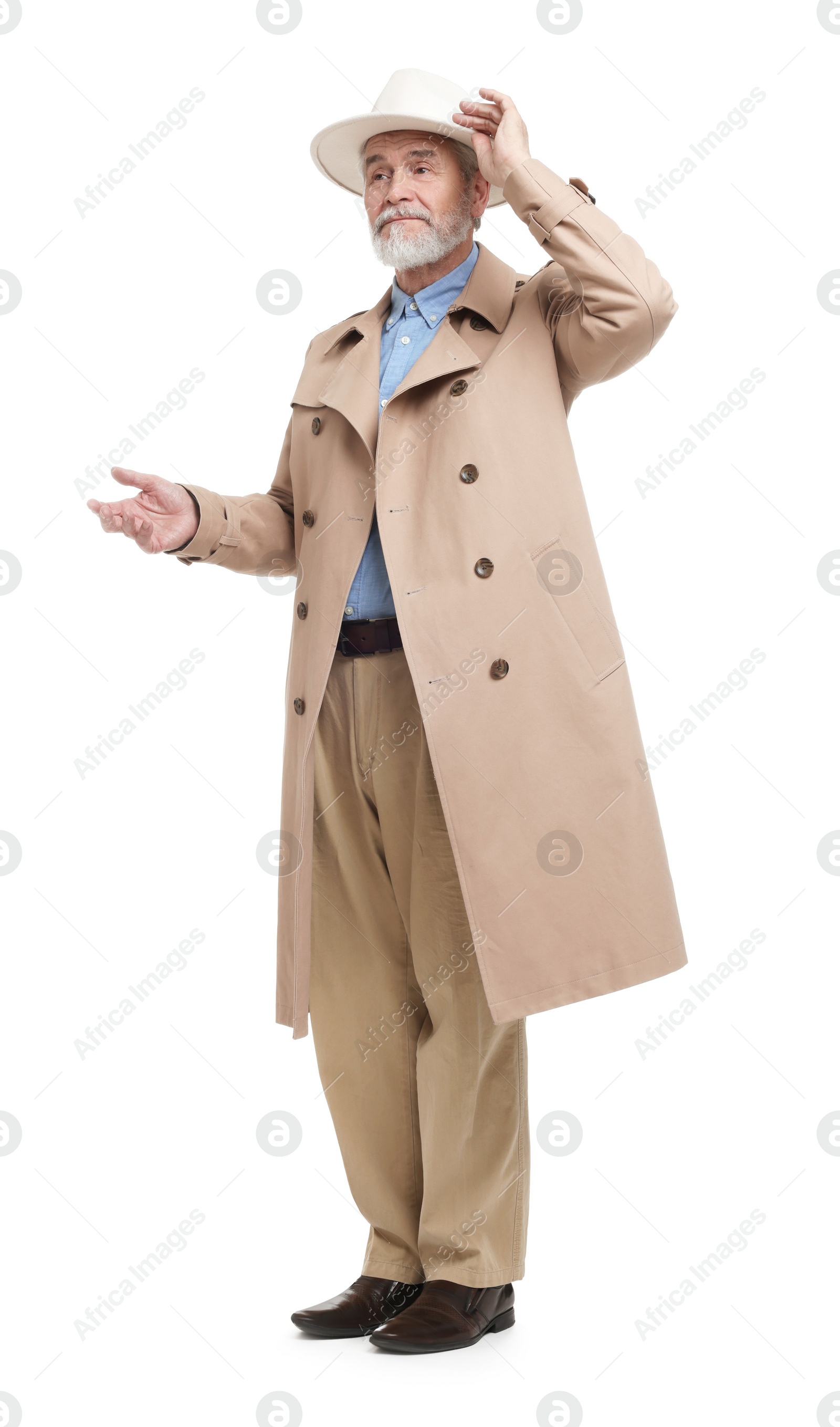 Photo of Senior man in hat and coat on white background