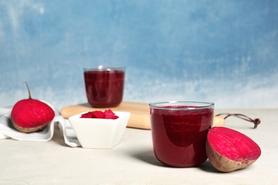 Glass of tasty beet smoothie on table