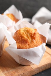 Tasty muffin on grey table, closeup. Fresh pastry