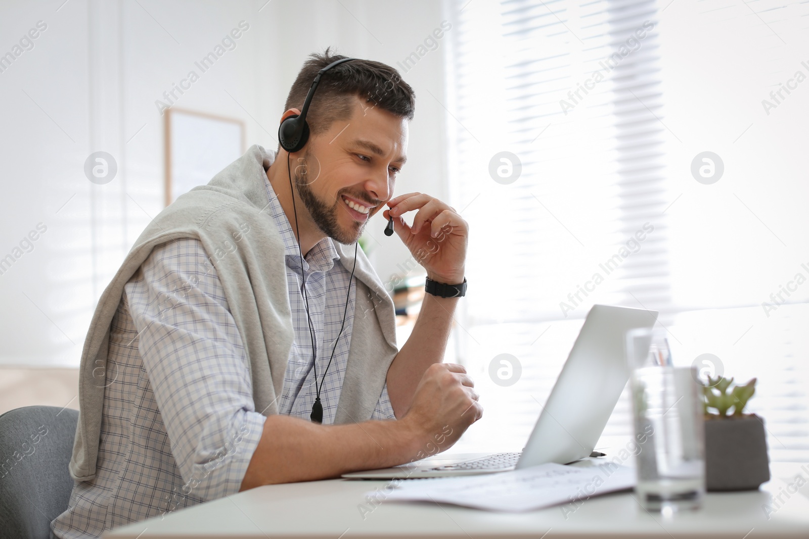 Photo of Teacher conducting online lesson at home during COVID-19 quarantine