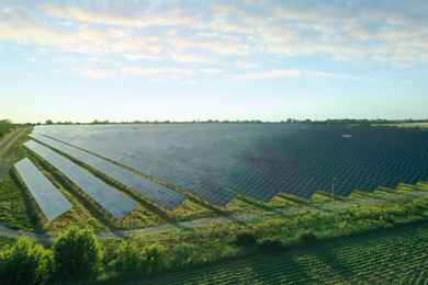 Solar panels installed outdoors, aerial view. Alternative energy source