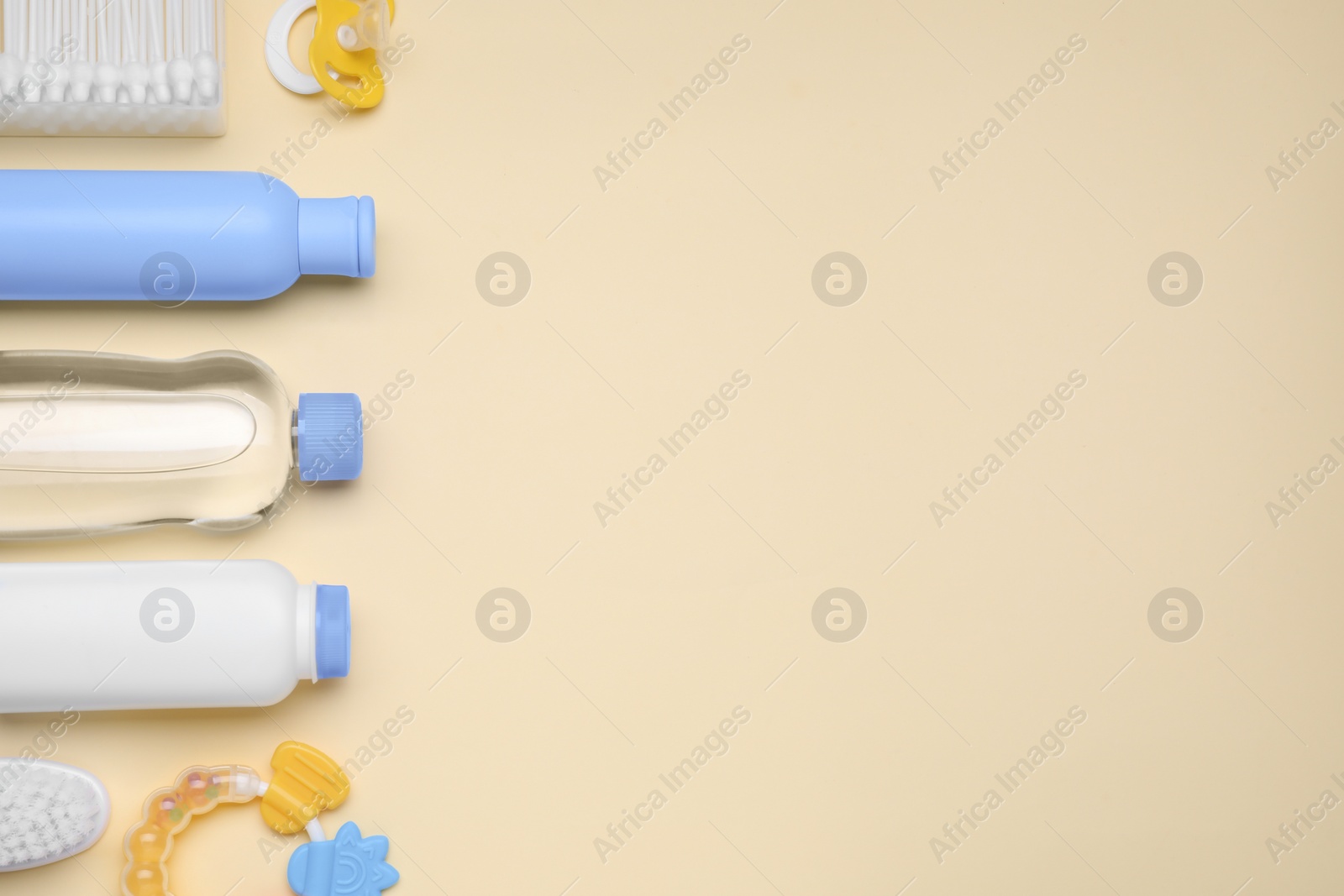 Photo of Flat lay composition with baby care products and accessories on beige background, space for text