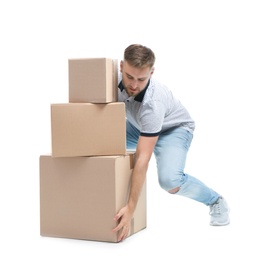 Photo of Full length portrait of young man lifting carton boxes on white background. Posture concept