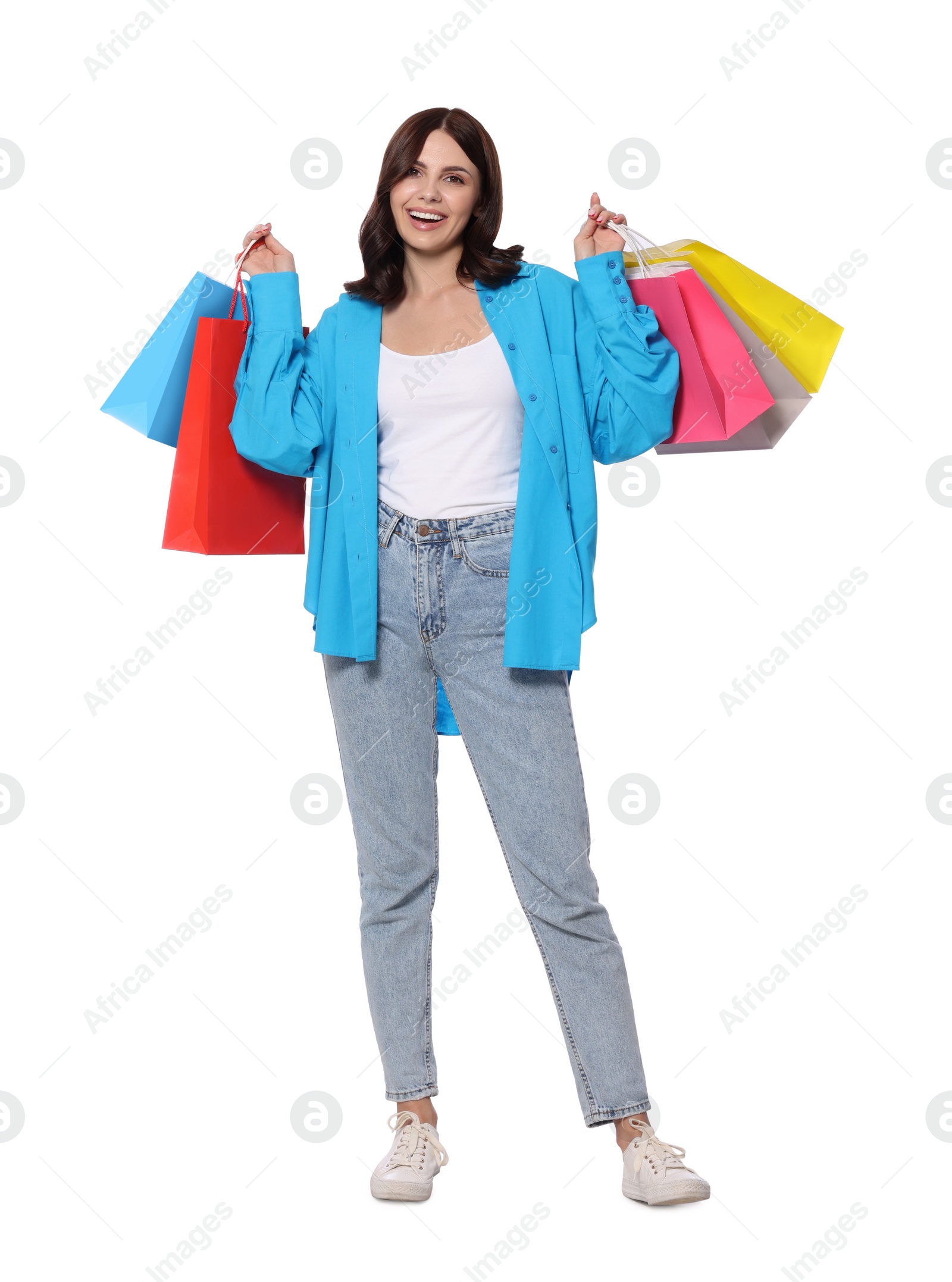 Photo of Beautiful young woman with paper shopping bags on white background