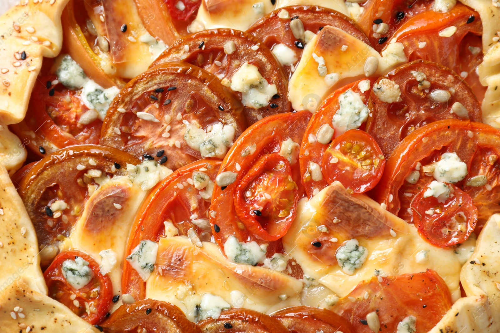 Photo of Tasty galette with tomato and cheese (Caprese galette) as background, top view