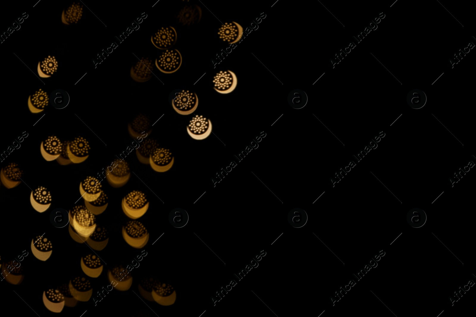 Photo of Blurred view of beautiful lights on black background. Bokeh effect