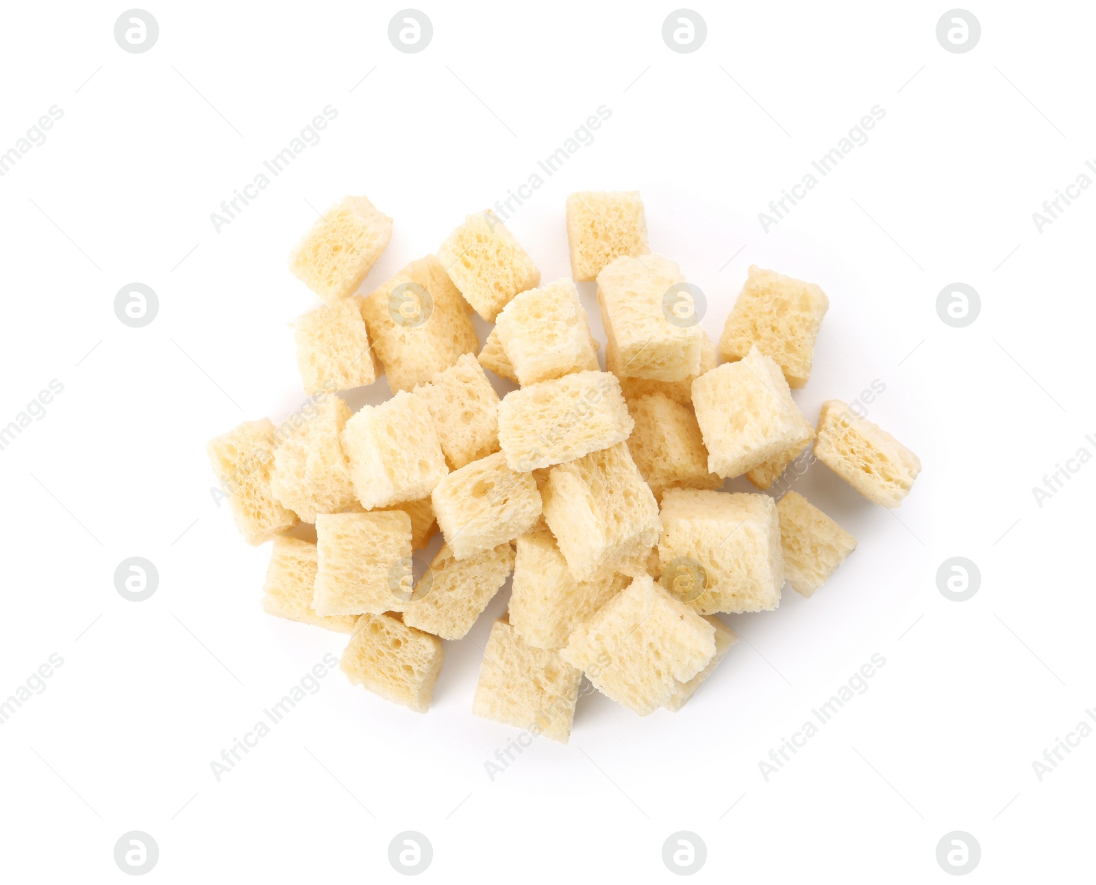 Photo of Heap of crispy croutons on white background, top view