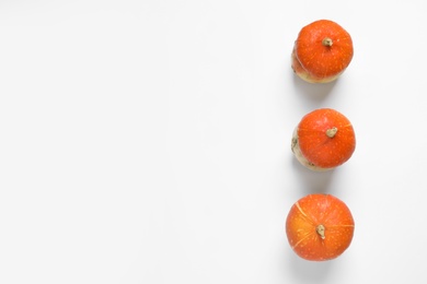 Photo of Orange pumpkins on white background, flat lay composition with space for text. Autumn holidays