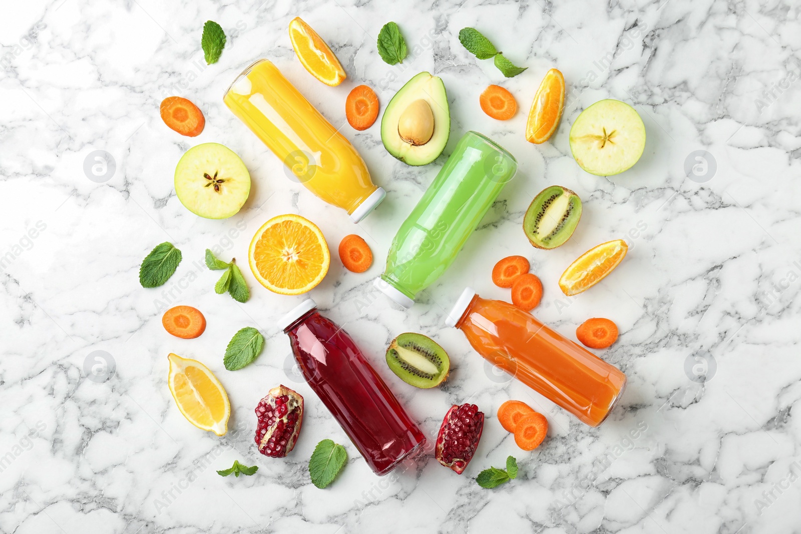 Photo of Flat lay composition with tasty juices and ingredients on marble background