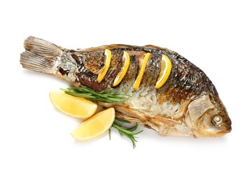 Photo of Tasty homemade roasted crucian carp with rosemary and lemon on white background, top view. River fish