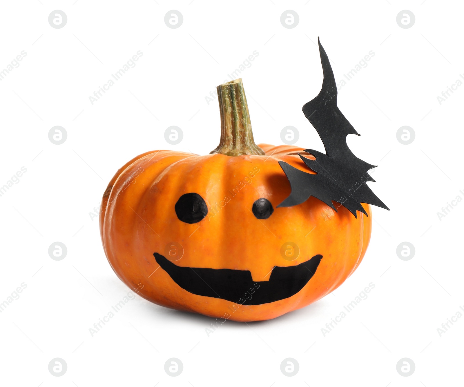 Photo of Halloween pumpkin with cute drawn face and paper bat isolated on white