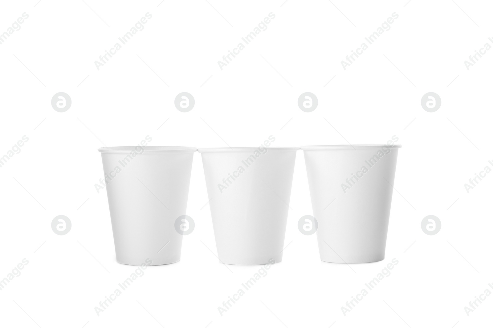 Photo of Empty disposable paper cups isolated on white