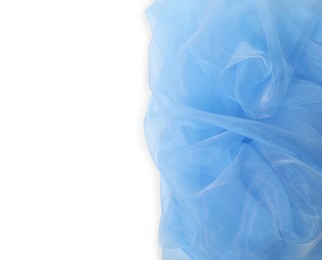 Beautiful light blue tulle fabric on white background, top view. Space for text