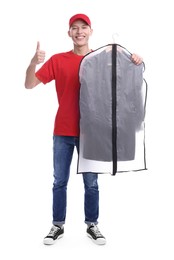 Dry-cleaning delivery. Happy courier holding garment cover with clothes and showing thumbs up on white background