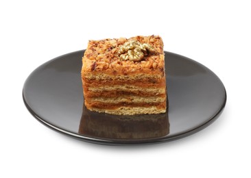 Photo of Piece of delicious layered honey cake on white background