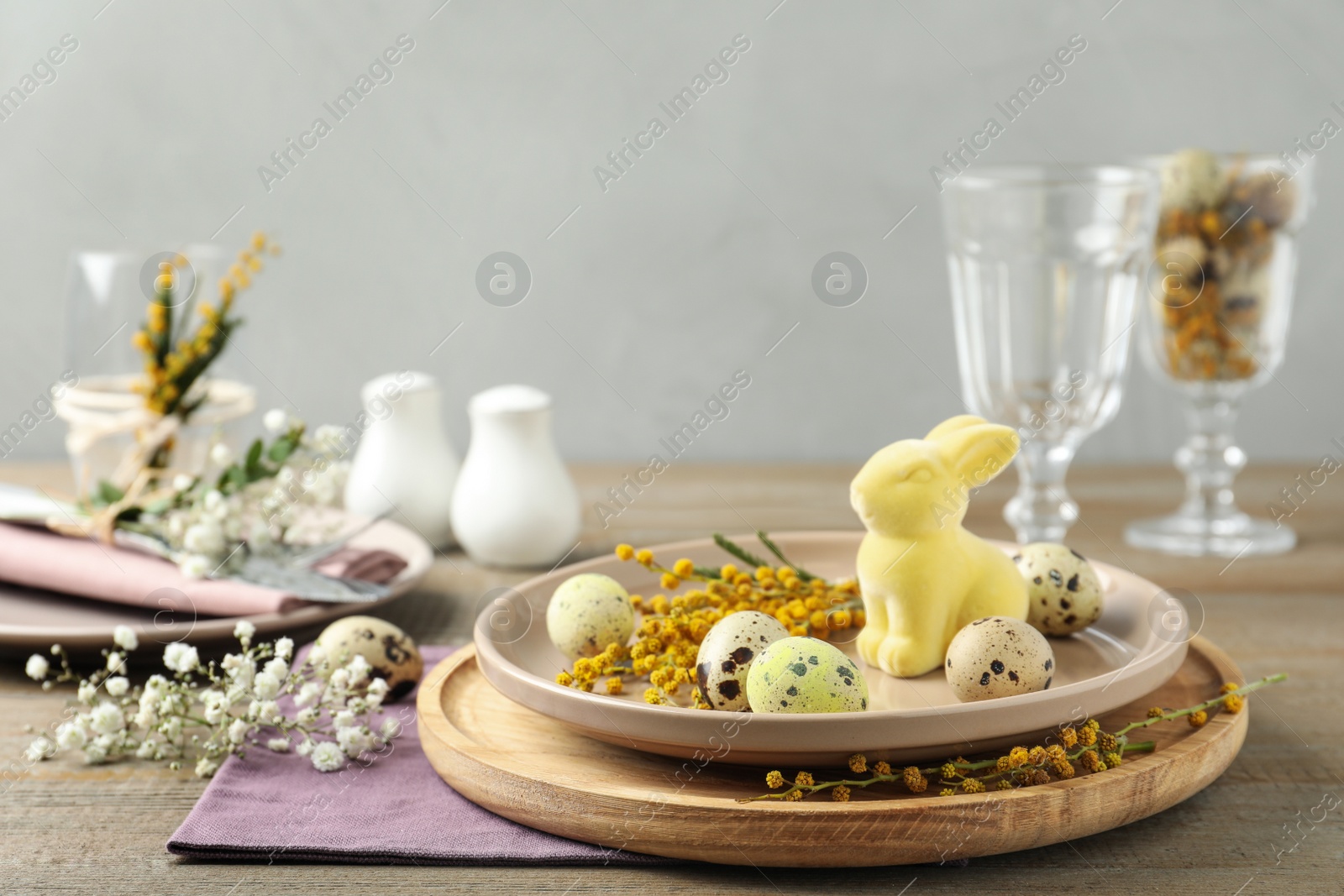 Photo of Festive Easter table setting with beautiful floral decor