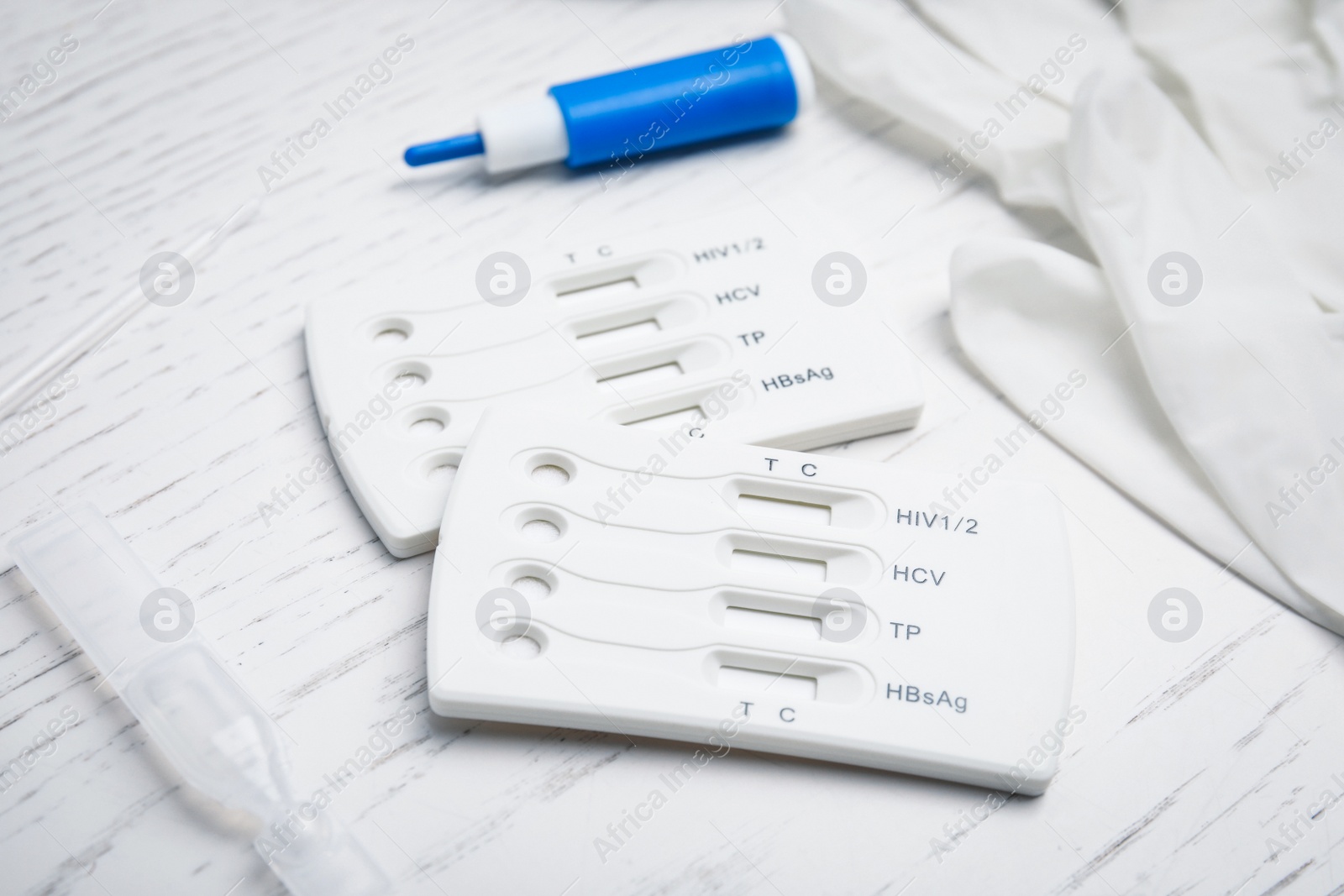 Photo of Disposable express test kit for hepatitis on white wooden table