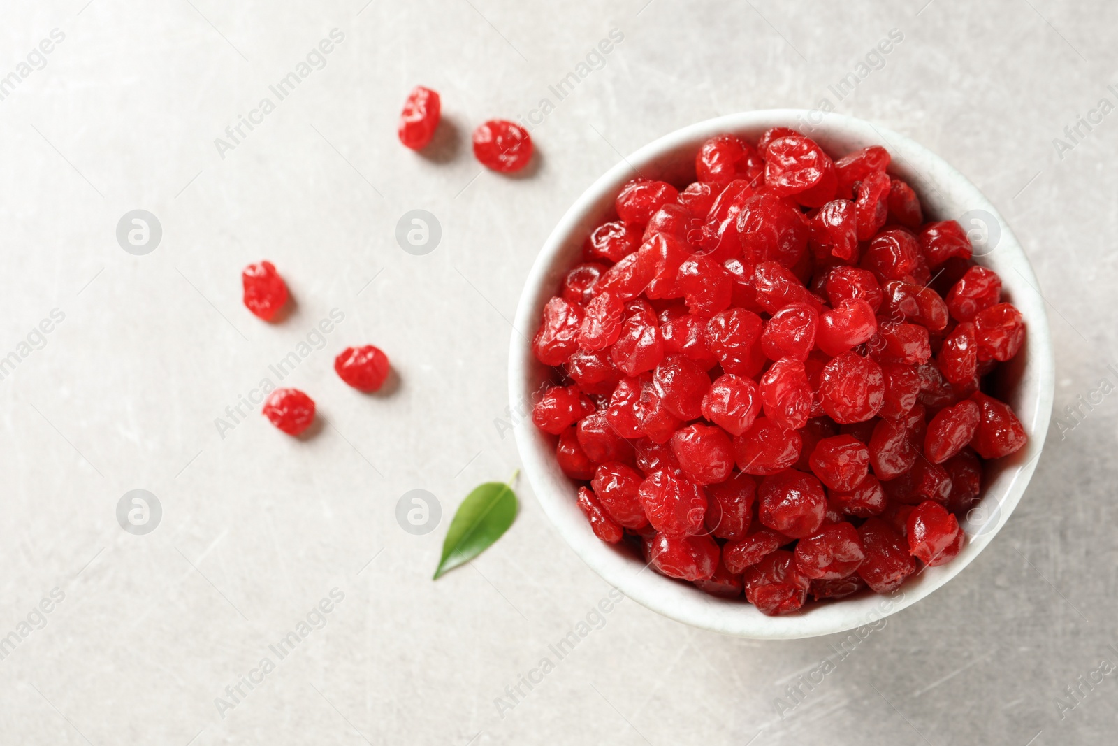 Photo of Bowl of sweet cherries on table, top view with space for text. Dried fruit as healthy snack