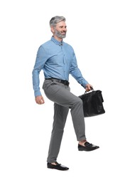 Mature businessman in stylish clothes with briefcase on white background