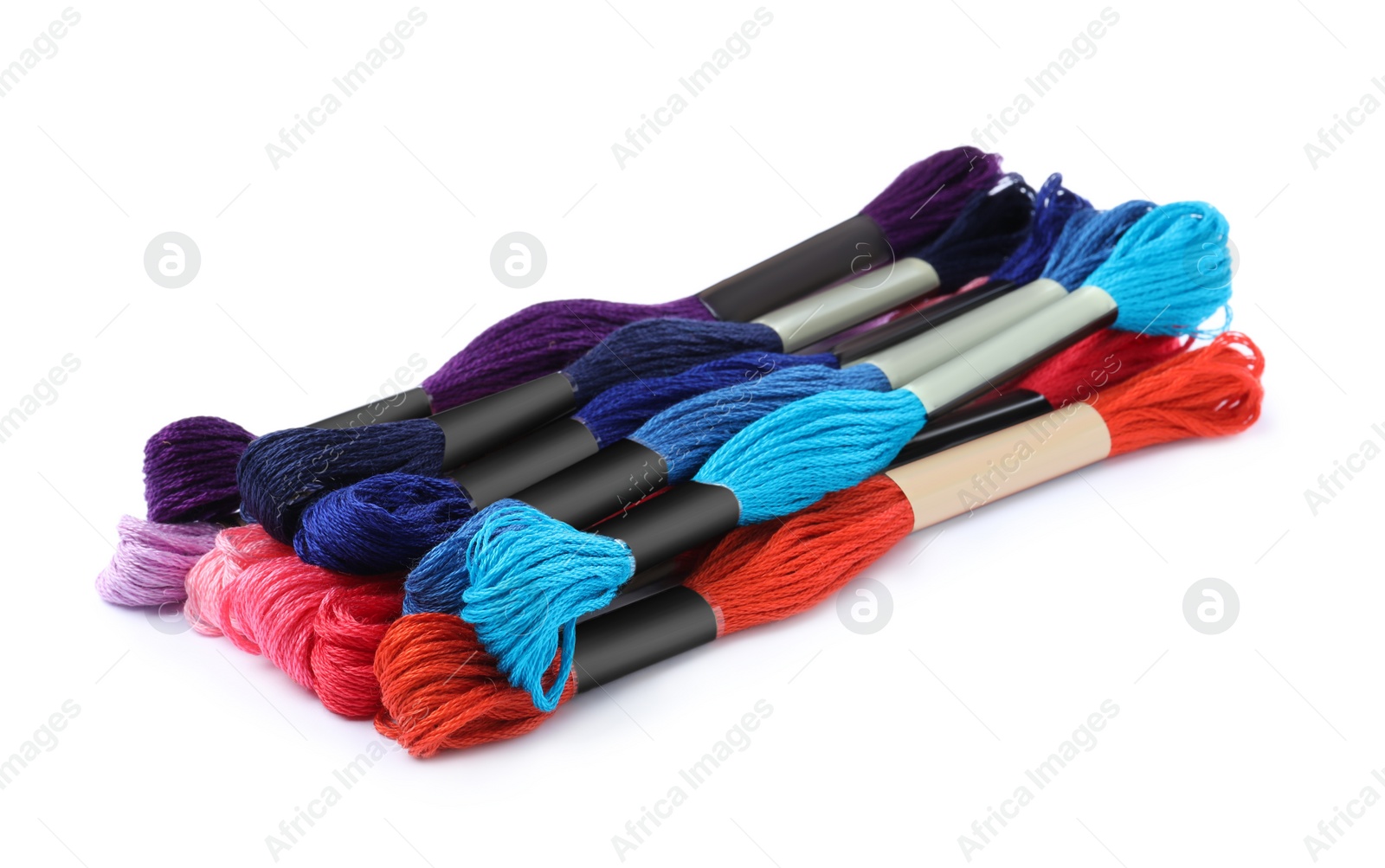 Photo of Set of colorful embroidery threads on white background