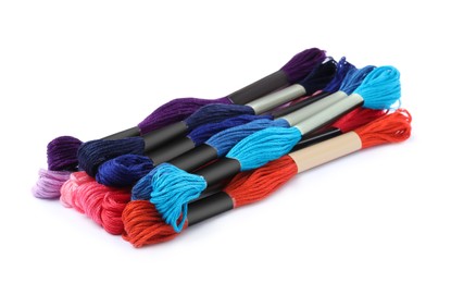 Photo of Set of colorful embroidery threads on white background