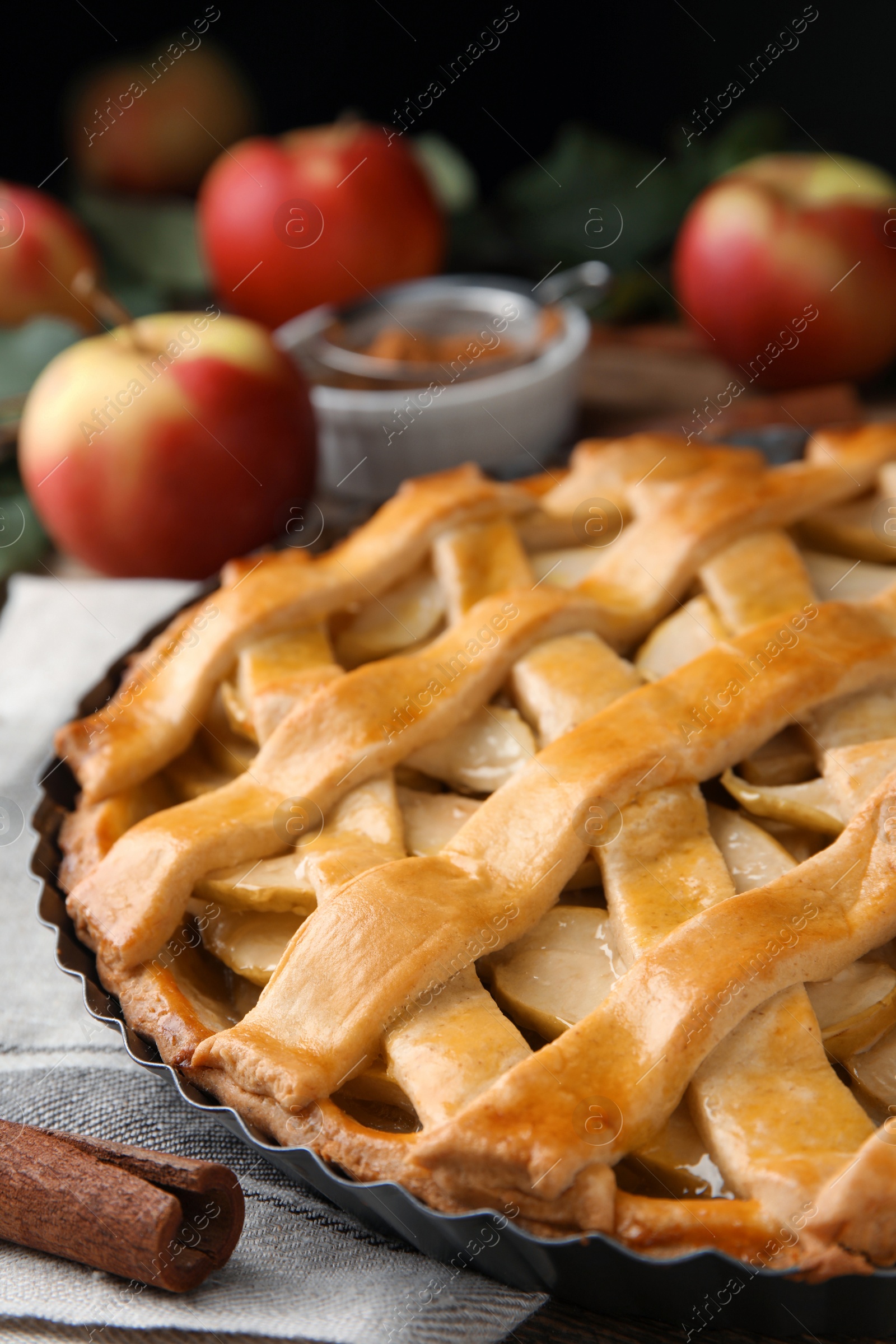 Photo of Delicious traditional apple pie on table, closeup