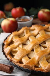 Delicious traditional apple pie on table, closeup