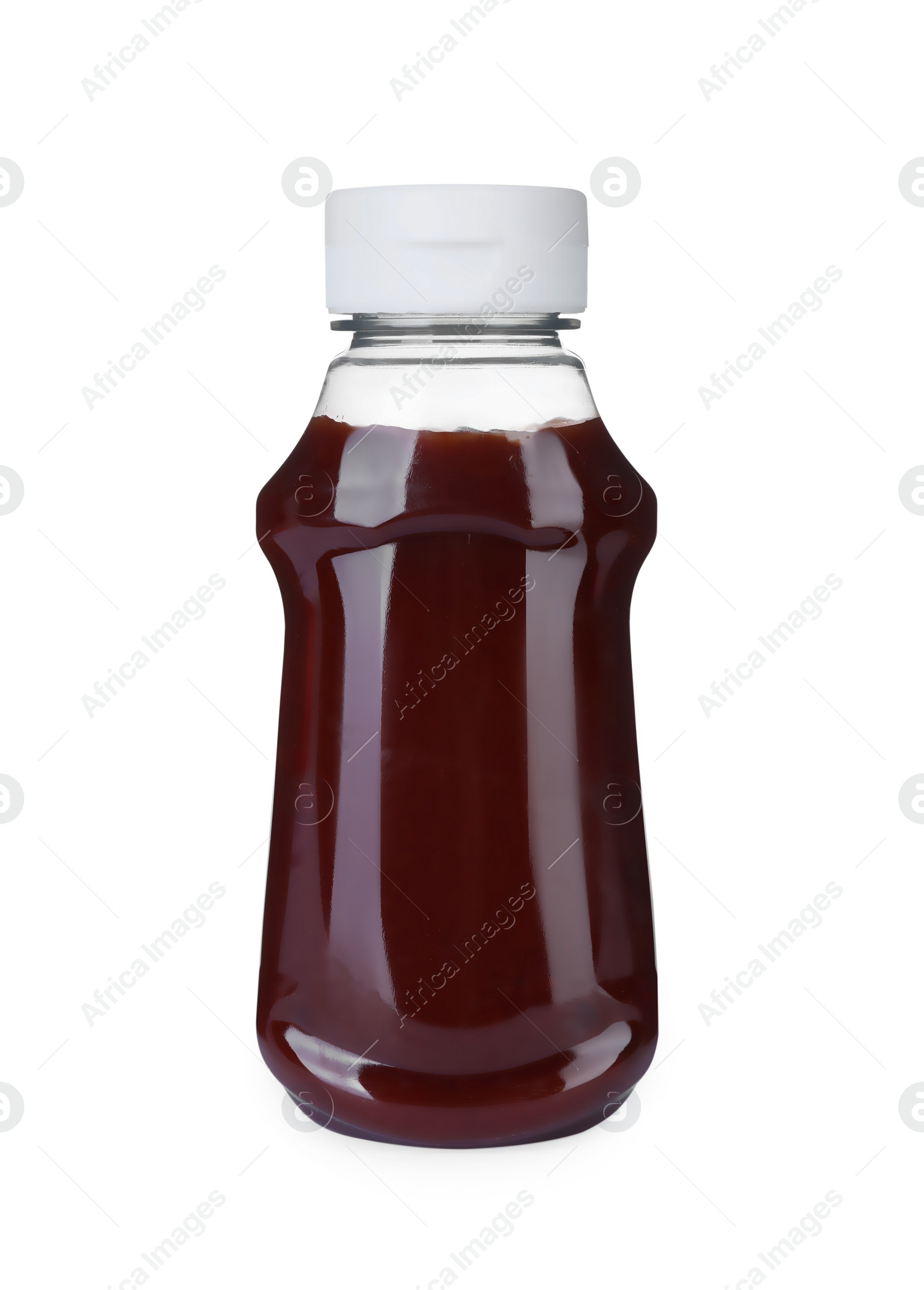 Photo of Bottle of tasty ketchup isolated on white